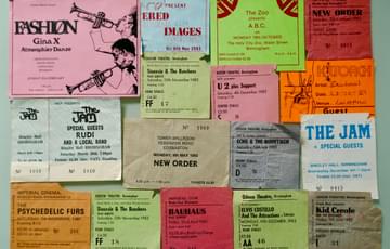 A grid of colourful gig tickets. They're all a bit rough and used. The band names can be seen on some - the Jam, New Order, Fashion, Psychedelic Ears.