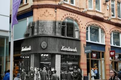 A merged photo of a corner of a building. Part of the photo is black and white and from the 1930-40s while the other photo is the building in the modern day.