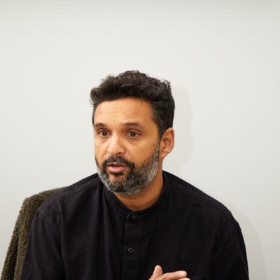 Faisal Hussain is shown talking.