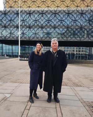 Ruth Millington and Stewart Lee standing outside The Library of Birmingham.