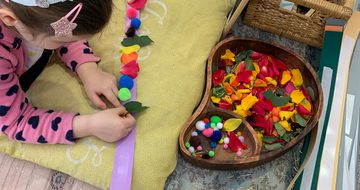Child taking part in a crafts activity.