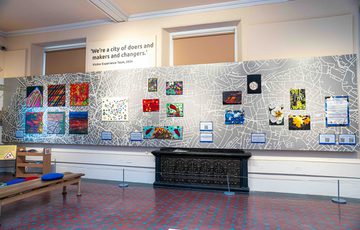 Image shows clusters if artwork by five artists from ATHAC, work includes paintings, clay mounted jewellery, textile collages and photography of natural surroundings.