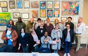 Citizens from Midland Mencap are pictured proudly in front of their artwork at the Birmingham Museum and Art Gallery.