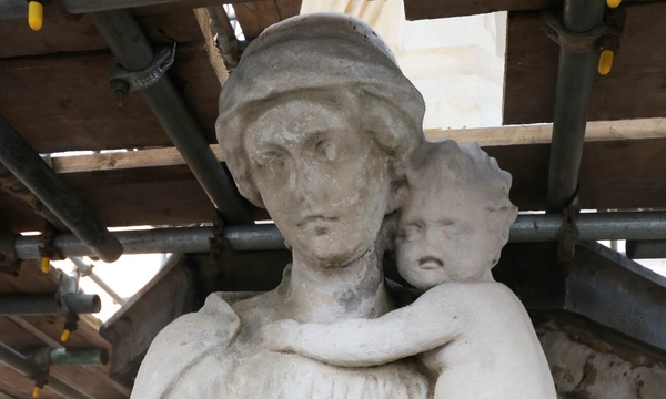 Charity figure with child looking cleaner after second clean.