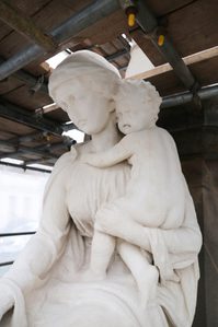 Charity figure with child after cleaning with all dirt gone.