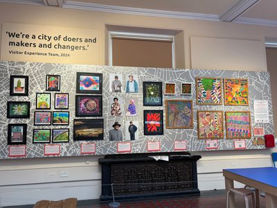 An exhibition showcasing a large selection of community artworks.