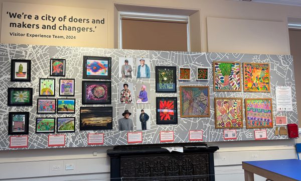 An exhibition showcasing a large selection of community artworks.