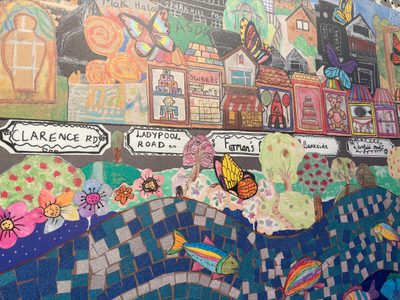 A close up of a colourful collage artwork