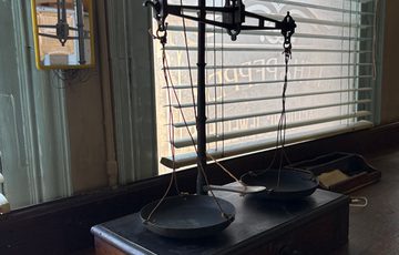Scales in a window and on a desk.