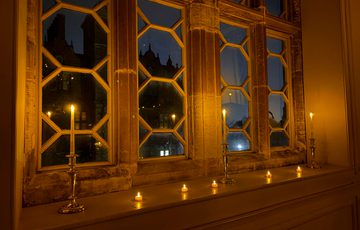 Window lit with candle lights.