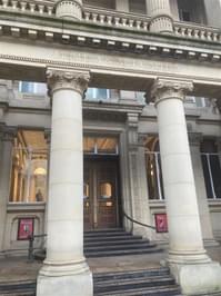 Exterior entrance with columns and stairs.