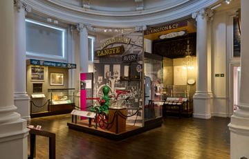 A circular gallery with historic pump on display.