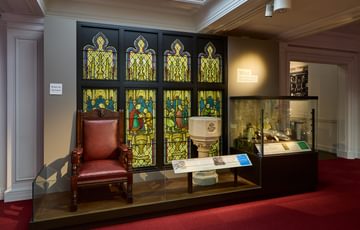 A large stained glass window on display.