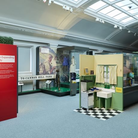 A wide shot of the gallery featuring a child's play kitchen.