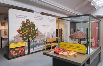 A gallery display should urban conurbation including a model for children to play with.