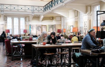 People sitting eating in the cafe.