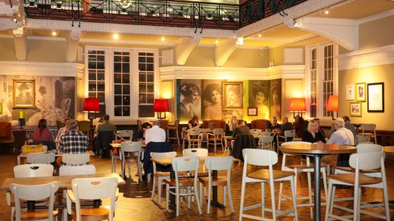 People sitting in the tearoom.