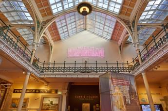 The Industrial Gallery ceiling with large neon sign that says 'Made in Birmingham'.