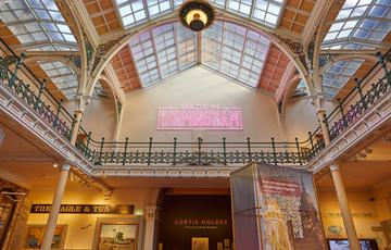The Industrial Gallery ceiling with large neon sign that says 'Made in Birmingham'.