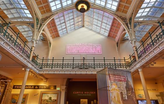 The Industrial Gallery ceiling with large neon sign that says 'Made in Birmingham'.