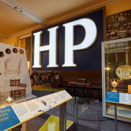 Two displays including objects from the furniture collection and metalwork collection.