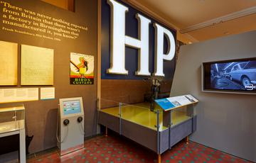 Display of Birmginham Brands including a large 'HP' sign. video of car manufacturing and Birds Custard.