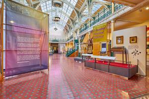 The Industrial Gallery, a large ornate gallery with ironwork arches and large glazed roof windows showing a display based on Made In Birmingham.