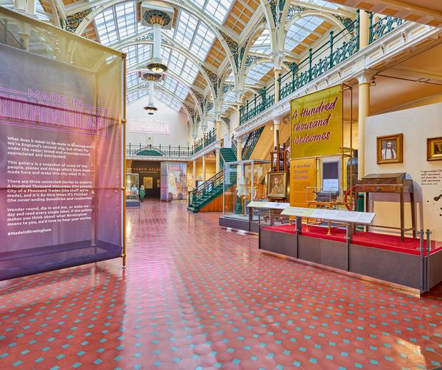 The Industrial Gallery, a large ornate gallery with ironwork arches and large glazed roof windows showing a display based on Made In Birmingham.