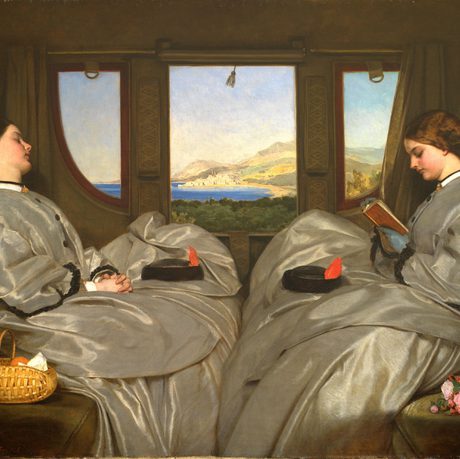 Two women in grey dresses seated by a window overlooking a scenic landscape.