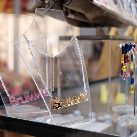 Jewellery that says 'Brummie' on display in the shop.