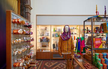 Items on display in a shop including Christmas decorations, a jacket and scarf