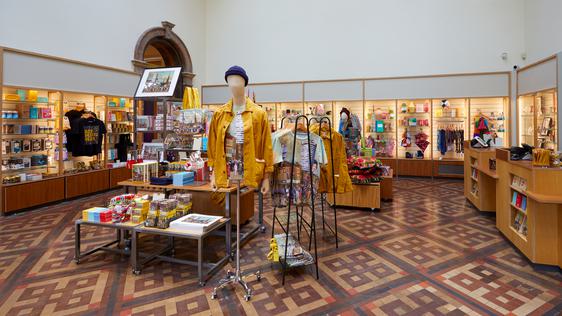 Museum shop featuring a variety of shop artefacts including clothes, prints and more.