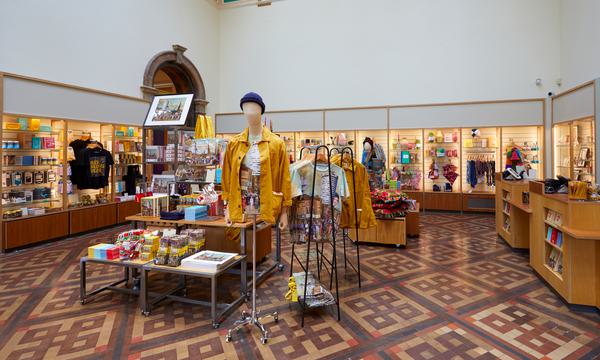 Museum shop featuring a variety of shop artefacts including clothes, prints and more.