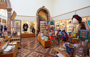 Shop display featuring hair accessories, books, t-shirts and more.
