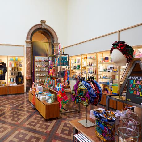 Shop display featuring hair accessories, books, t-shirts and more.