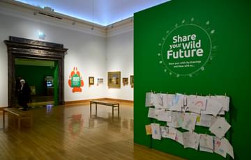 A gallery with an area for people to pin their own artworks.