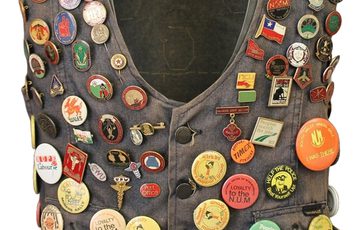 Waistcoat covered in badges.