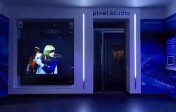A video of Ozzy Osbourne performing on display in the pixel studio.