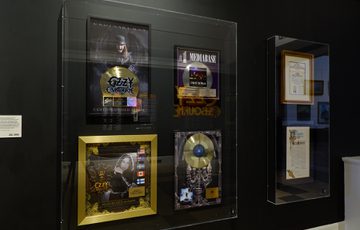 A group of Ozzy Osbourne discs on display.
