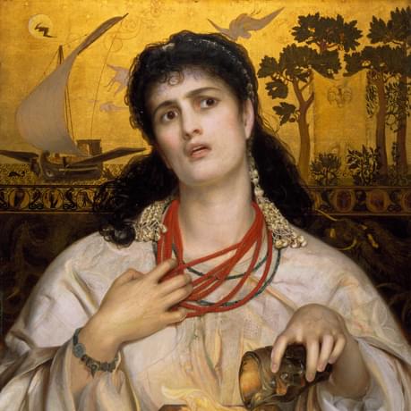A lady with dark hair is seated. She is pouring a liquid from a beaker into a lit burner and her head is titled while she holds onto her read bead necklace. The background is gold with details of a ship and trees.