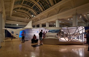 A gallery with large 3d model and skull of an ancient whale.