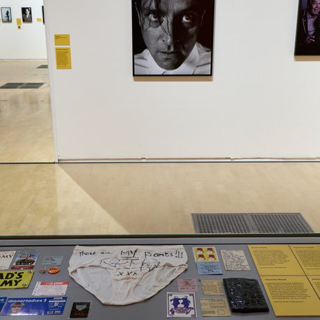 Display case with memorabilia, including Rik Mayall's underwear.