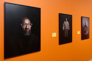 Photographs of Lenny Henry, Joe Lycett and Jasper Carrott on display.