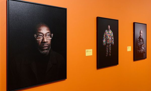 Photographs of Lenny Henry, Joe Lycett and Jasper Carrott on display.