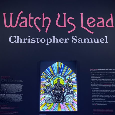 Stained glass window with 'Watch us Lead Christopher Samuel' above.