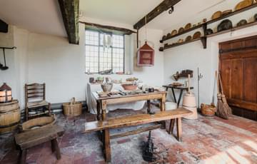 Kitchen with table, bench and utensils from Tudor times