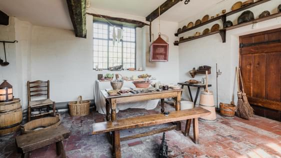Kitchen with table, bench and utensils from Tudor times