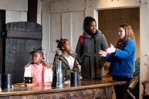 A BMT staff member telling a family about the Great Hall at Blakesley