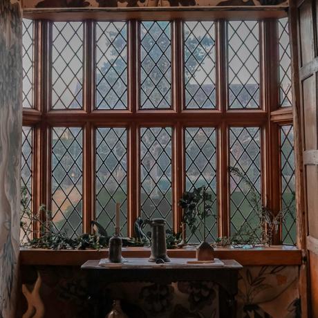 A large Tudor window with table and objects on it