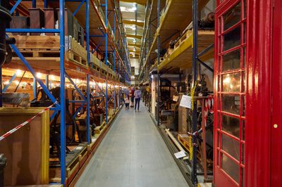 Warehouse racks containing old examples of machinery